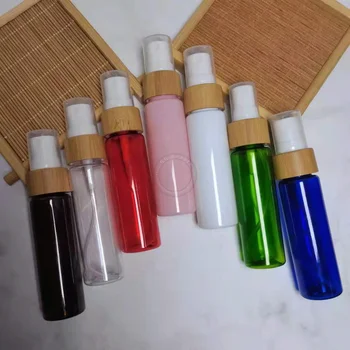 Търговия на едро за многократна употреба 30ml цветни кръгли пластмасови бутилки с бамбуков диск Топ винтови капаци Парфюми спрей пулверизатор празни тръби 1OZ